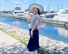 Load image into Gallery viewer, Woman carry a shoulder bag and standing by a marina with boats and a clear blue sky.