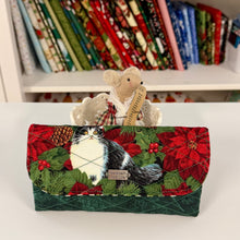 Load image into Gallery viewer, Decorative handmade wallet with cat and mouse design, held by a small plush mouse, against a background of wrapped gifts.
