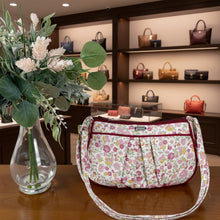 Load image into Gallery viewer, Floral-patterned handbag and vase with flowers on a wooden surface