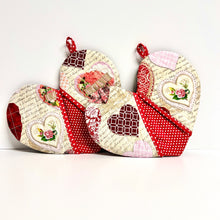 Load image into Gallery viewer, Valentine's Day potholders; Heart-shaped potholders; Quilted pot holders; Romantic kitchen accessories; Love-themed potholders; Valentine's Day kitchen décor; Heart quilted hot pads; Handmade Valentine's gifts; Kitchen essentials for Valentine's; Heart quilted trivets; Romantic home décor; Couples' cooking accessories; Valentine's Day cooking gifts; Red and pink potholders; Unique kitchen Valentine's gifts