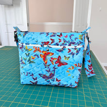 Load image into Gallery viewer, Messenger bag; 
Crossbody bag;
Messenger style crossbody bag;
Quilted Cotton crossbody messenger bag
Women&#39;s crossbody messenger bag
Urban messenger bag
Eco-friendly messenger bag
Crossbody bag for traveler bag
Adjustable strap messenger bag
Stylish crossbody bag
